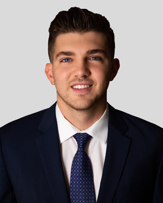 Portrait of Arian Hoxha, Licensed Real Estate Advisor.